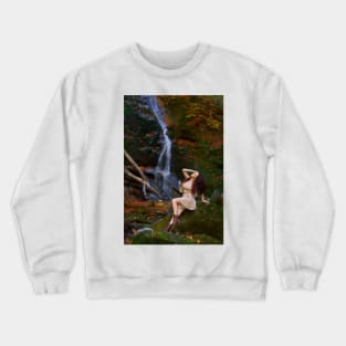 Beautiful young woman by a waterfall Crewneck Sweatshirt